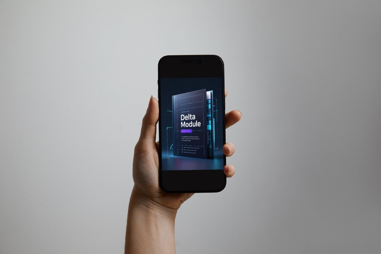 A hand holding a black smartphone against a plain light gray background. The phone screen displays a digital cover for a course or module titled 'Delta Module'.