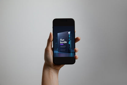 A hand holding a black smartphone against a plain light gray background. The phone screen displays a digital cover graphic for a 'Flux Bundle'.