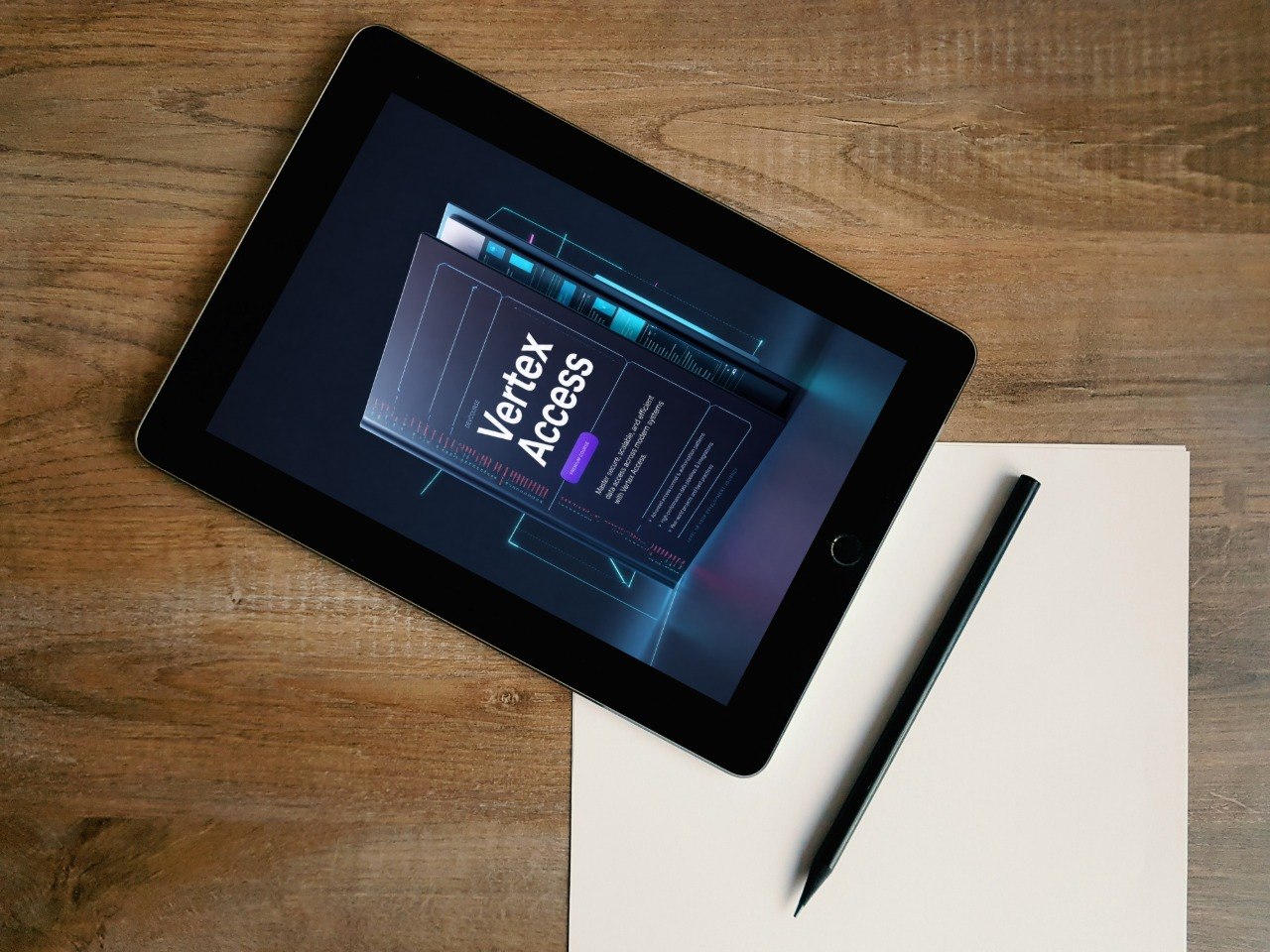 A black tablet lying diagonally on a wooden desk, displaying a digital interface titled 'Vertex Access.' A white sheet of paper and a black stylus are placed beside it.